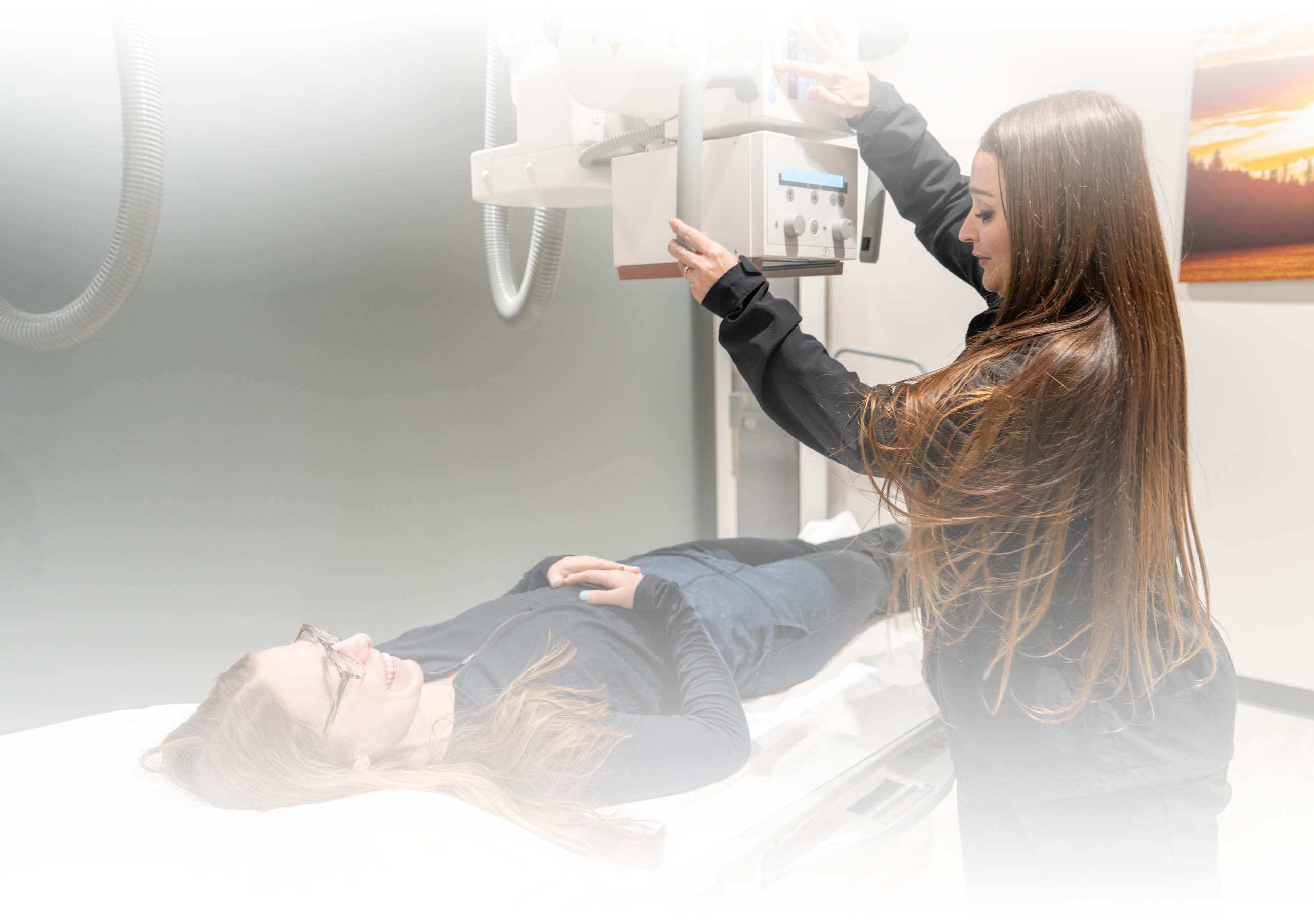 A technician prepares a patient for an RF scan
