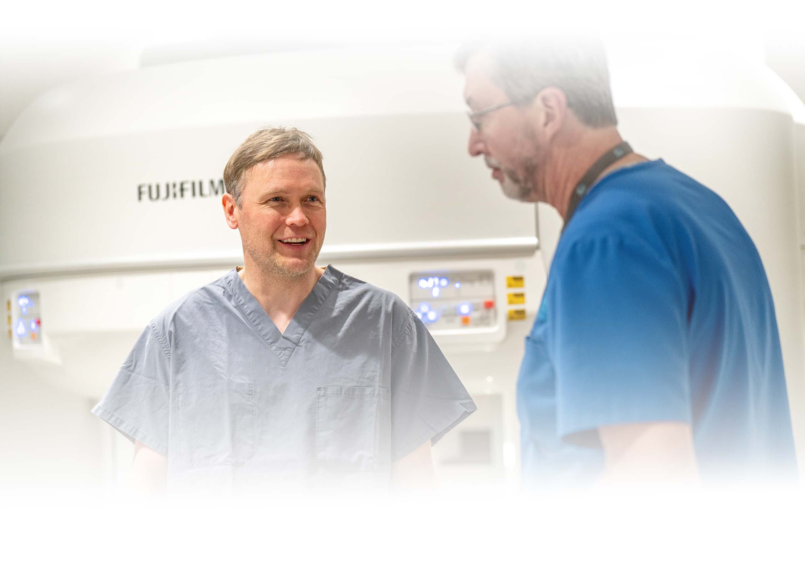 A patient and technician talking after an MRI scan