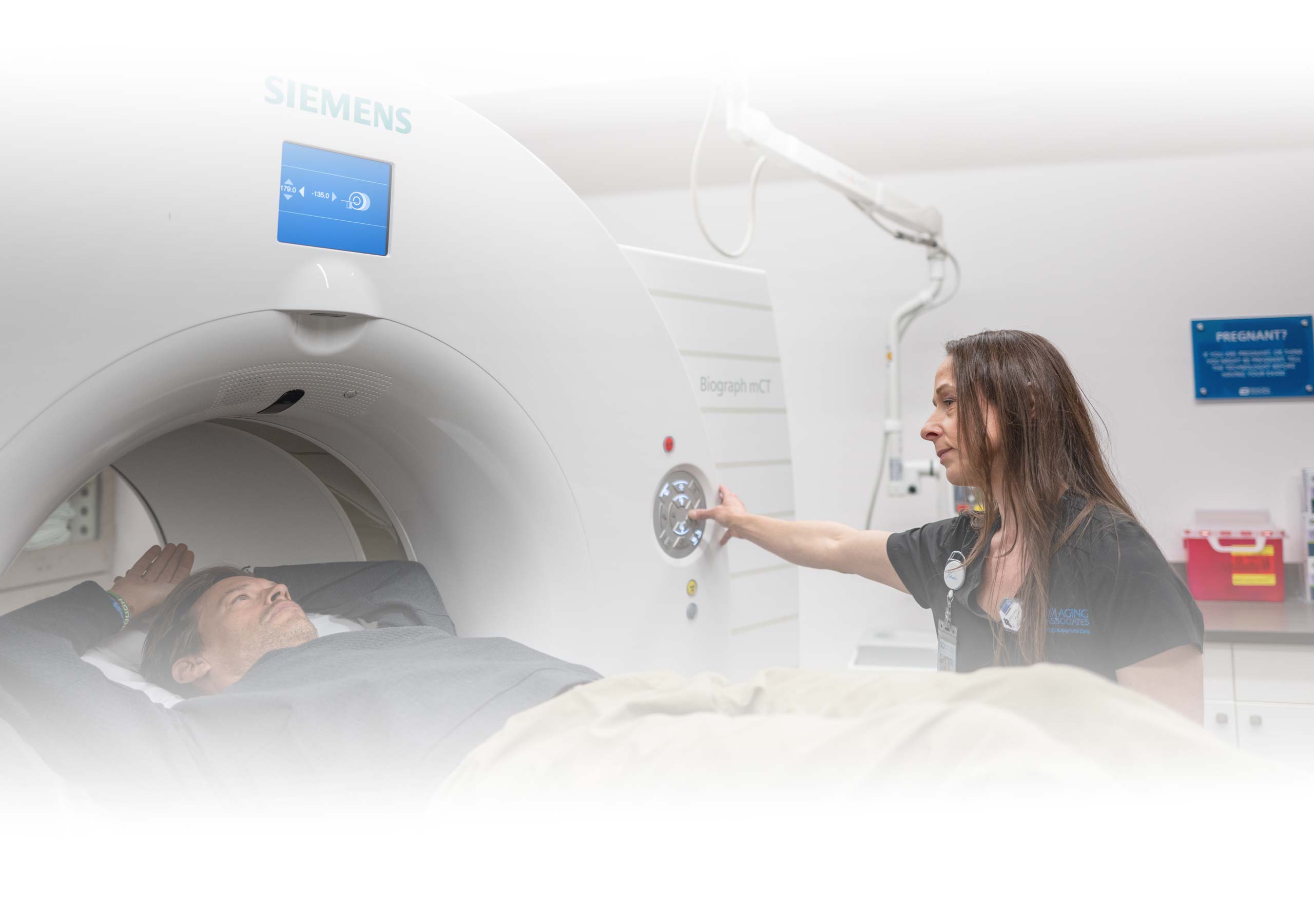 A patient being prepared for a CT scan