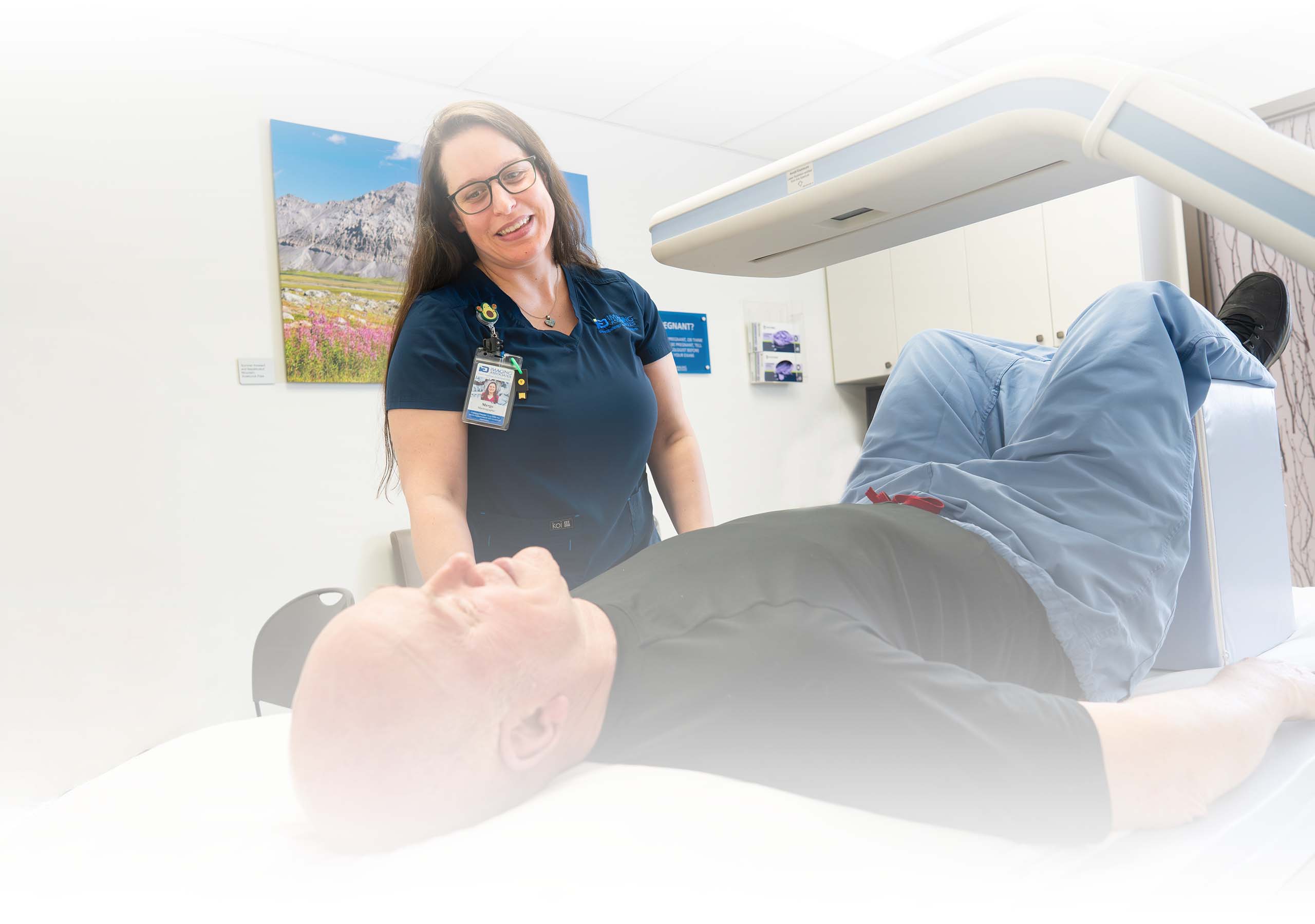 Technician helping a patient get comfortable for a DEXA scan